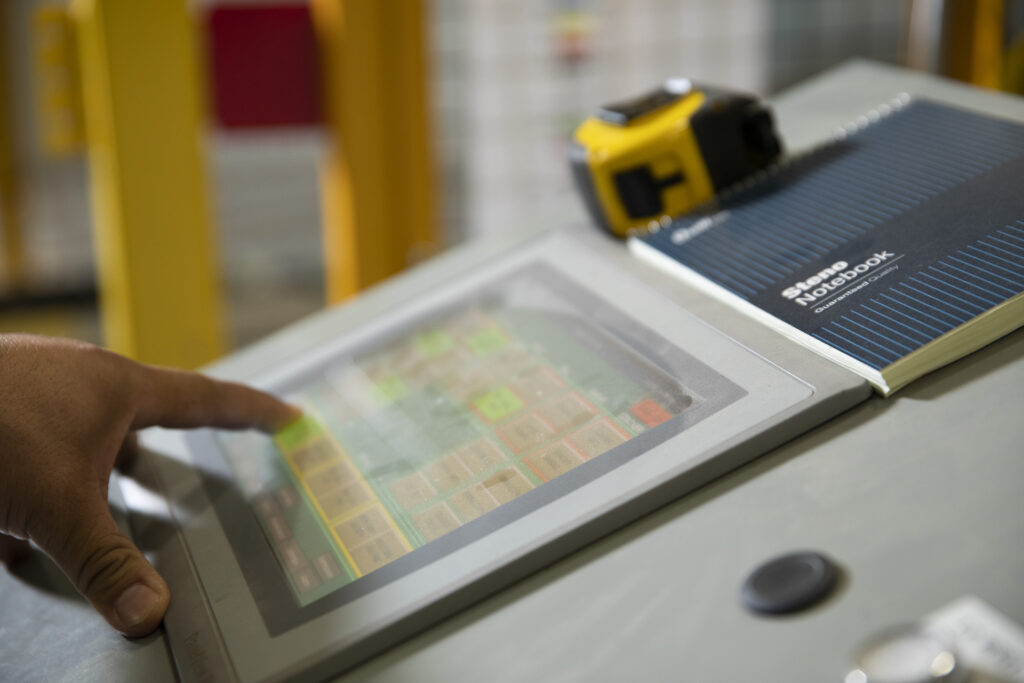 person entering order on machine control panel