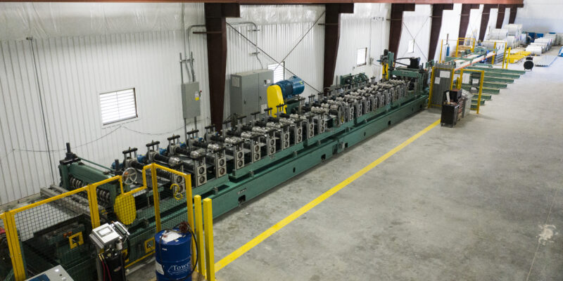 csm's metal deck manufacturing equipment in their warehouse facility